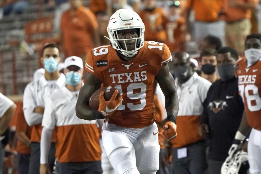 Texas' Malcolm Epps (19) runs after a catch against UTEP during the second half of an NCAA college football game in Austin, Texas, Saturday, Sept. 12, 2020. (AP Photo/Chuck Burton)