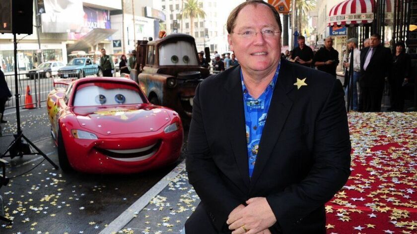 Director John Lasseter poses in front of characters from his movie "Cars" at his Hollywood Walk of Fame star presentation ceremony,