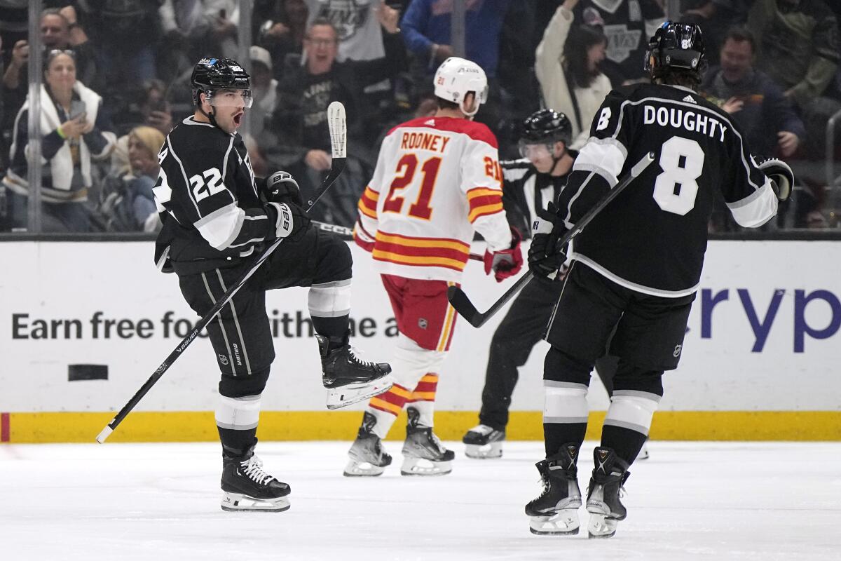 Kings forward Kevin Fiala, left, celebrates with defenseman Drew Doughty after scoring against the Calgary Flames.