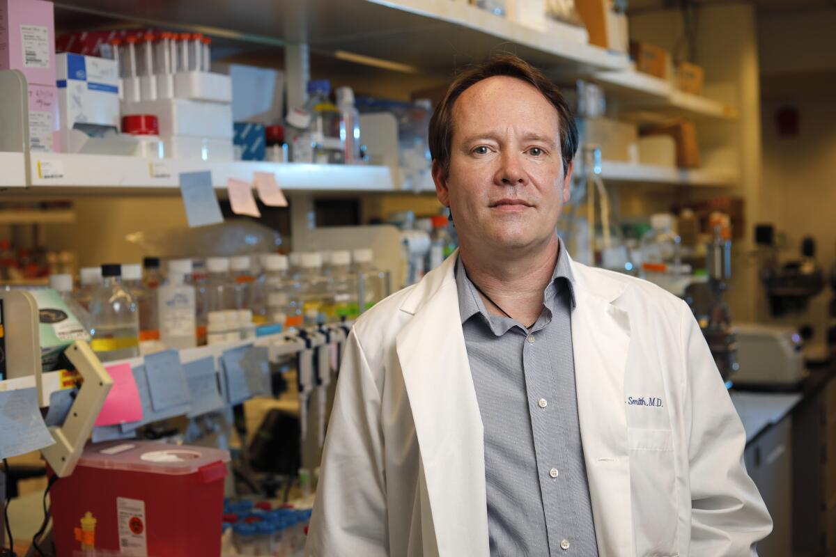 Dr. Davey Smith is a translational research virologist, shown in the lab at UC San Diego on June 2.