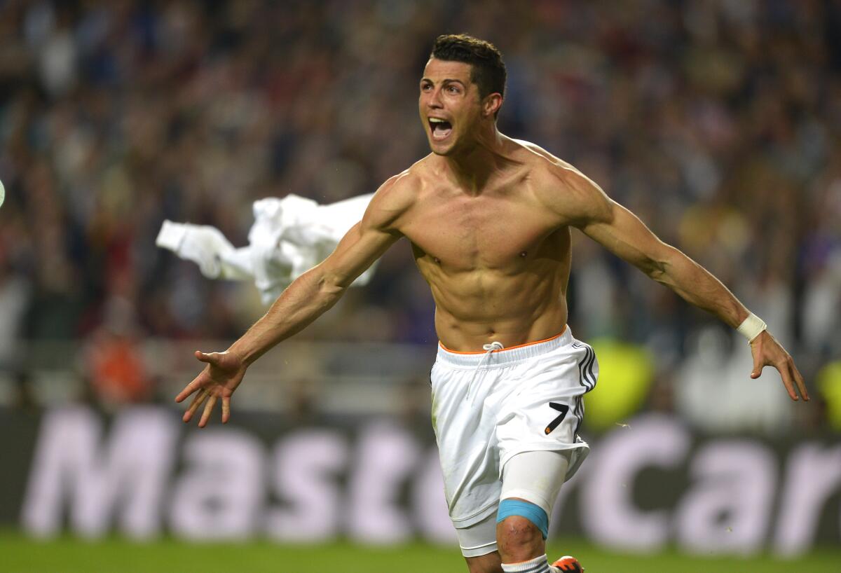 FILE - Real's Cristiano Ronaldo, gestures, at the end of the Champions League final soccer match between Atletico Madrid and Real Madrid, at the Luz stadium, in Lisbon, Portugal, in Lisbon, Portugal, Saturday, May 24, 2014. Cristiano Ronaldo, one of soccer's greatest ever players, was official unveiled for Saudi Arabian team Al Nassr on Tuesday, Jan. 3, 2023. Ronaldo, who has won five Ballon d'Ors awards and five Champions League titles, spent the past two decades at the top level of the European game, playing at three of the biggest clubs in the world: Manchester United, Real Madrid and Juventus. (AP Photo/Manu Fernandez, File)