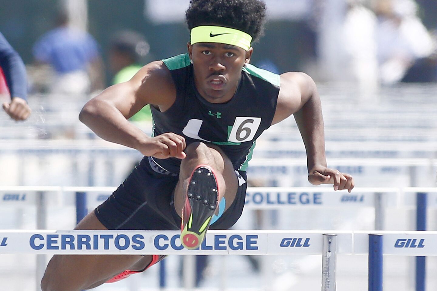 Upland's Joseph Anderson powers over the last hurdle to win the Division 1 boys' 110-meter hurdles during the CIF Southern Section finals at Cerritos College.