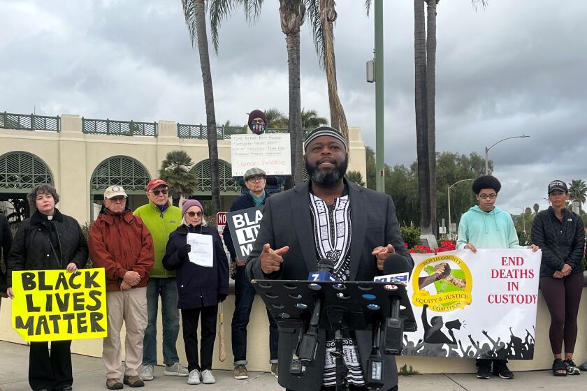 Protesters gathered outside Escondido City Hall on Sunday to speak out against police violence.