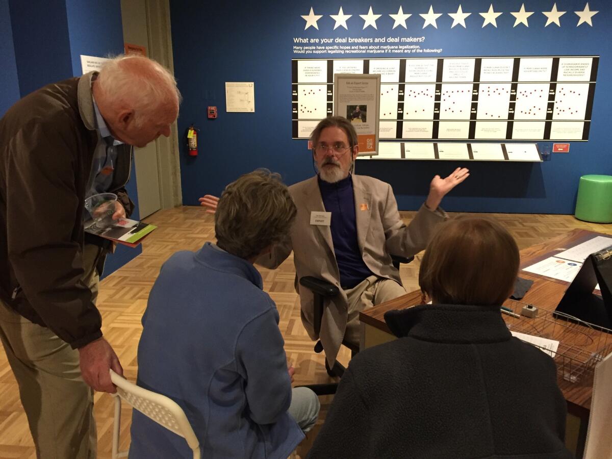 Dale Gieringer, a coauthor of California's medical cannabis law, answers questions about marijuana at the Oakland Museum of California's "Altered State" exhibit.