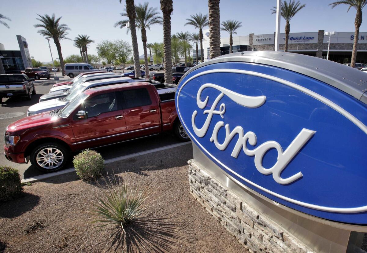 Ford said its investment in Pivotal will enhance its software capabilities. Above, a Ford dealership in Arizona.