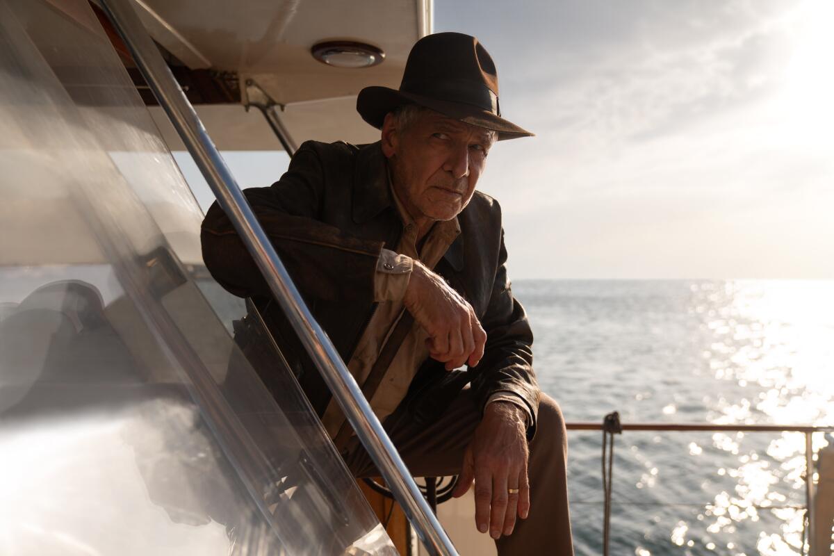 Harrison Ford as Indiana Jones, on a boat.