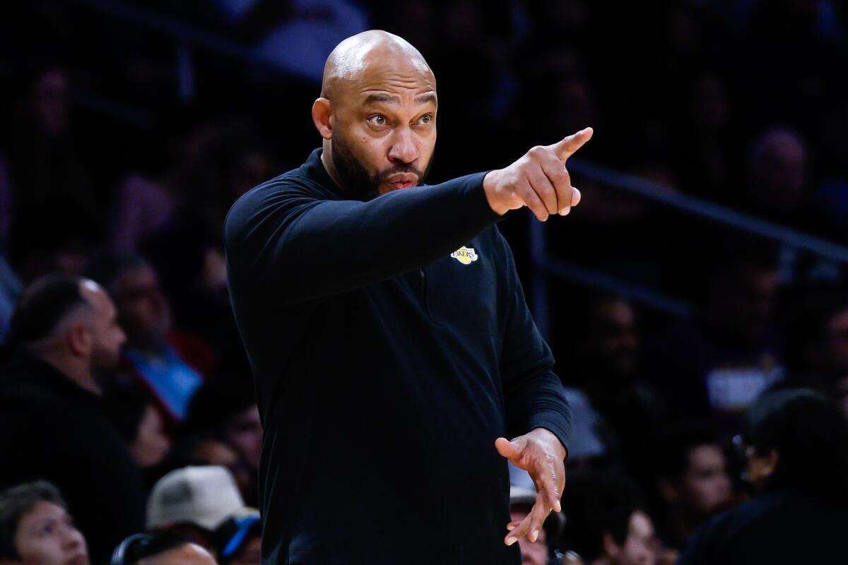 Lakers coach Darvin Ham points to his players from the sideline during a 106-103 win over the Clippers at Crypto.com Arena.