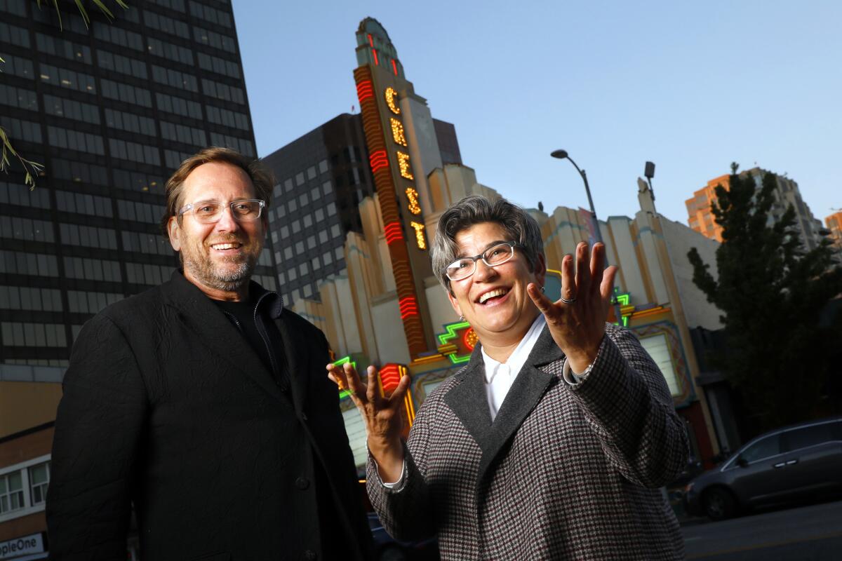 UCLA's Brett Steele and Kristy Edmunds stand in front of the Crest Theater in Westwood.