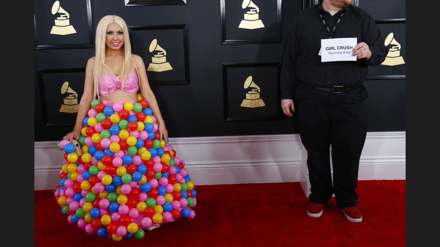 Recording artist Girl Crush wears a dress of colorful balls during the arrivals.