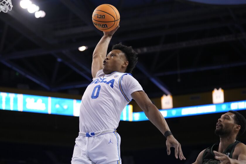 UCLA guard Jaylen Clark (0) drives to the basket against Sacramento State during the second half of an NCAA college basketball game Monday, Nov. 7, 2022, in Los Angeles. (AP Photo/Marcio Jose Sanchez)