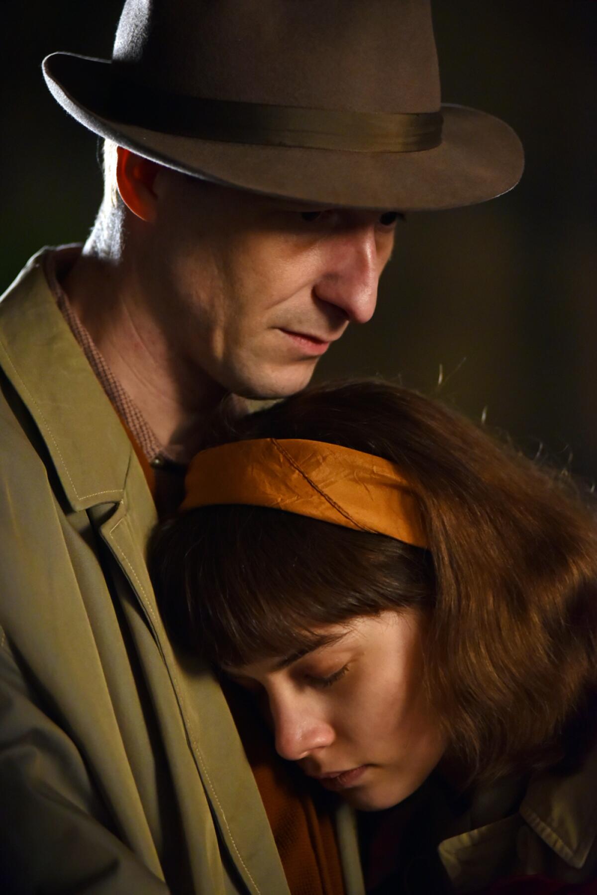Abigél Szőke rests her head on Károly Hajduk's chest in the movie "Those Who Remained."
