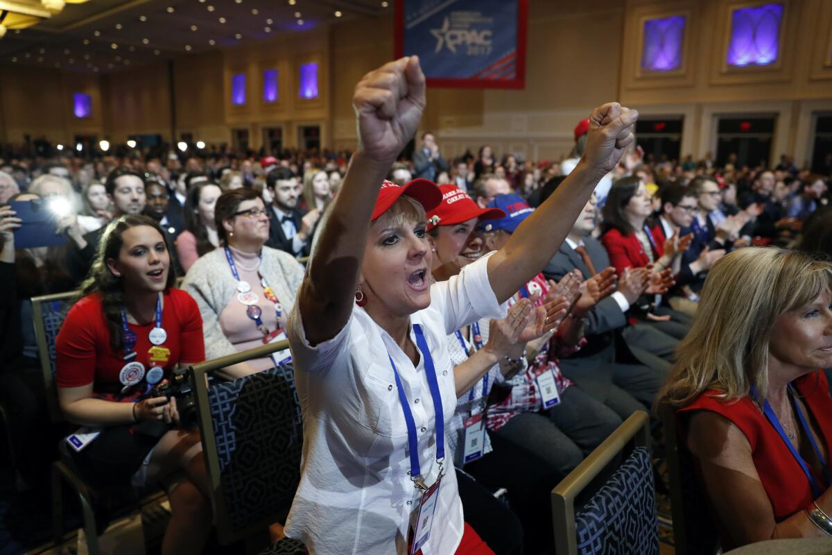 Supporters cheer President Trump as he speaks at the Conservative Political Action Conference in National Harbor, Md., on Friday.