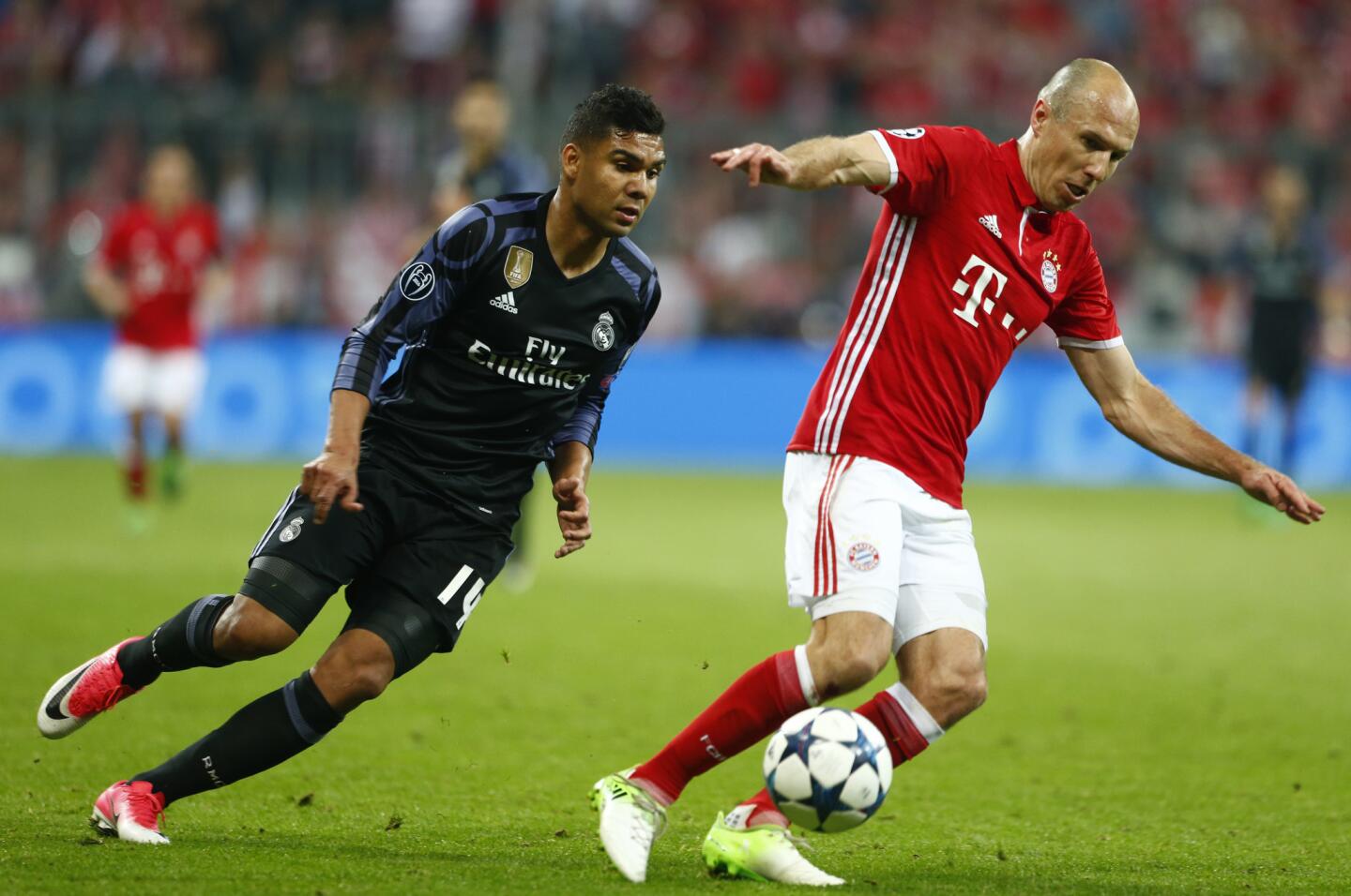 Bayern Munich's Arjen Robben in action with Real Madrid's Casemiro