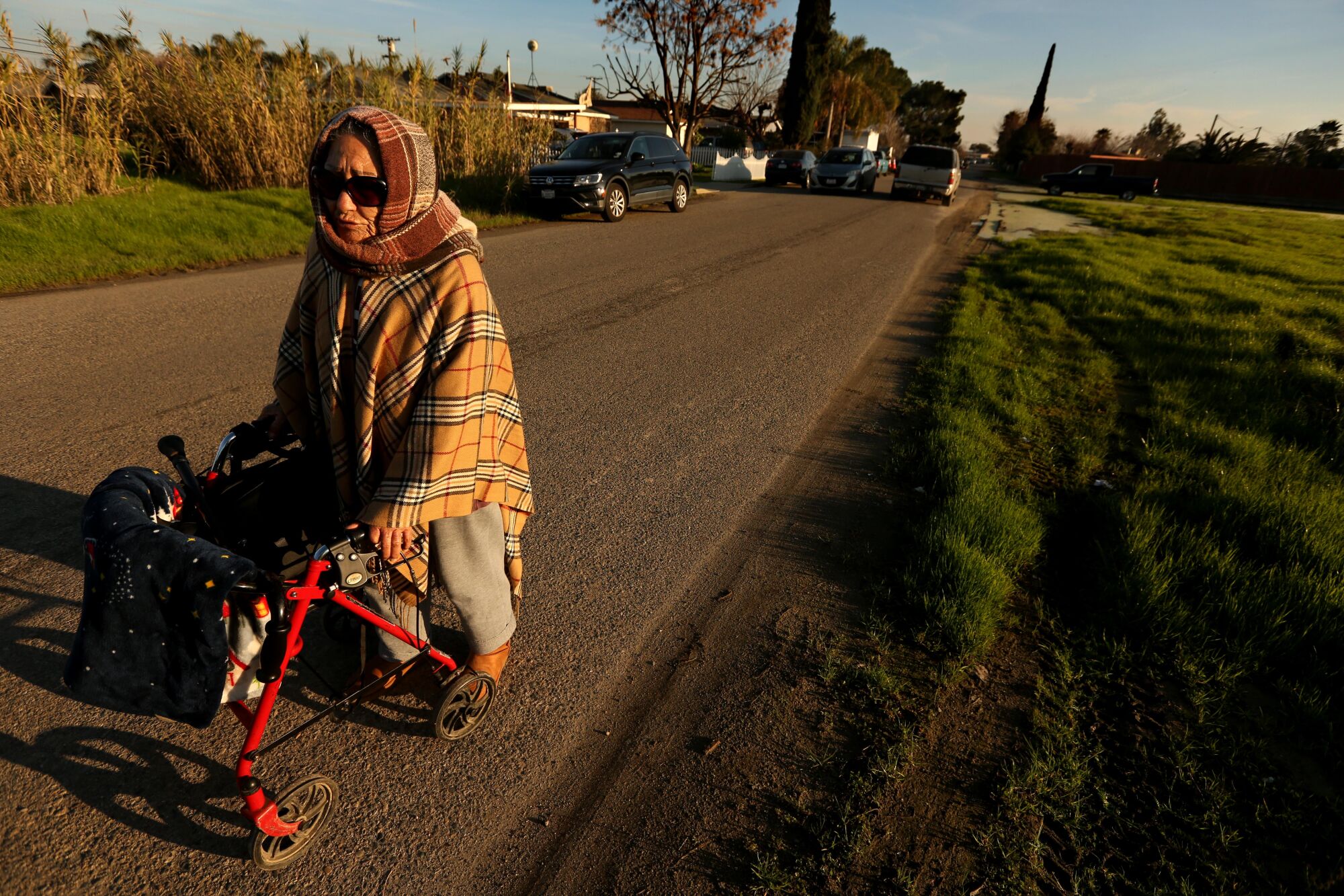 A woman headed toward the store with her walker in the town of Goshen.