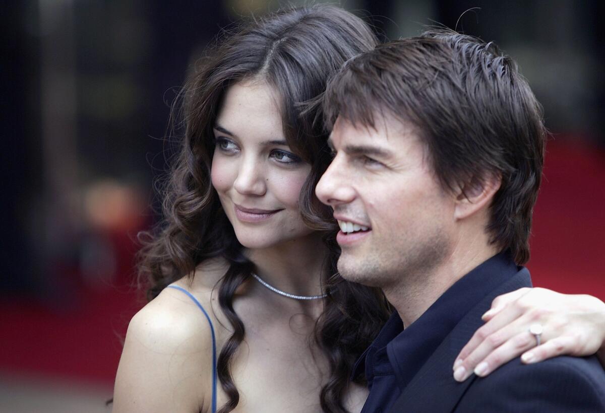 Katie Holmes and Tom Cruise arrive at the "War Of The Worlds" premiere.