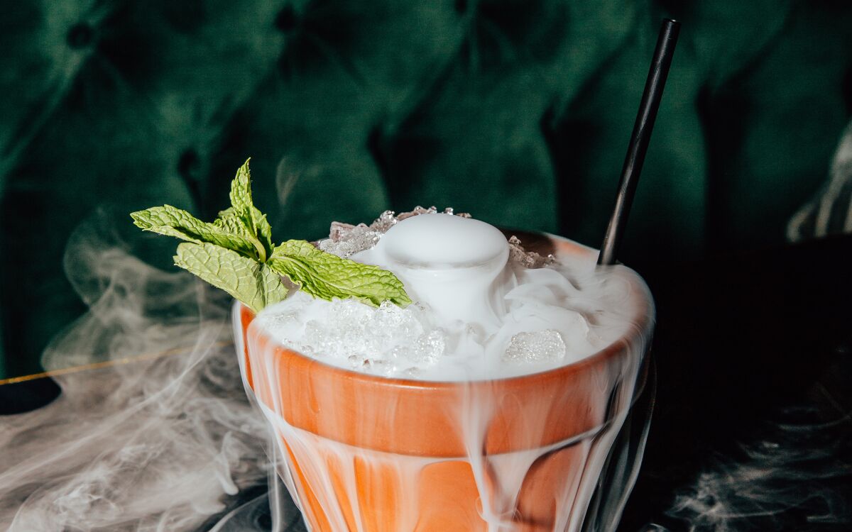 The Smoking Pot cocktail from V DTLA bar and restaurant in downtown L.A. is served in a clay pot with dry ice.