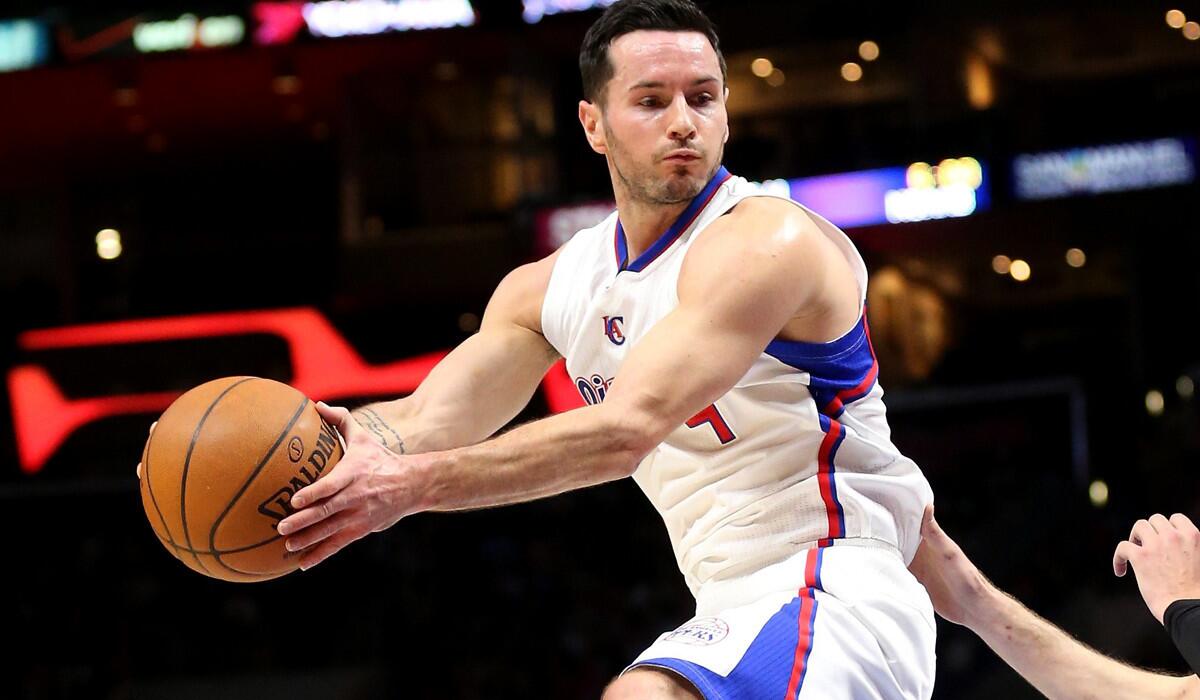 Clippers guard J.J. Redick pulls down a rebound against the Knicks on Wednesday night at Staples Center.