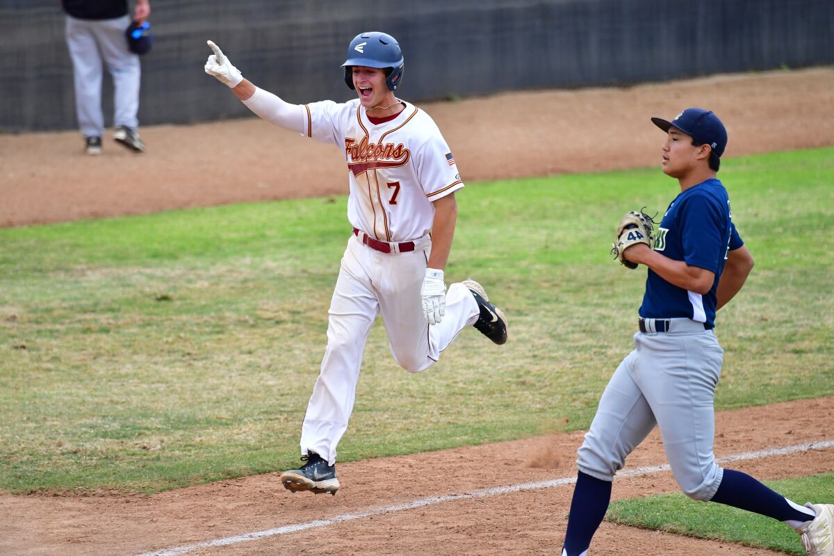 Carson Williams celebrates scoring the winning run over La Costa Canyon for the league championship on June 2.