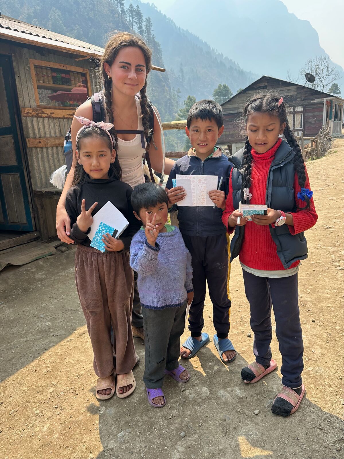 Lexi Gallo meets children in Nepal during her trek to the Mount Everest Base Camp.