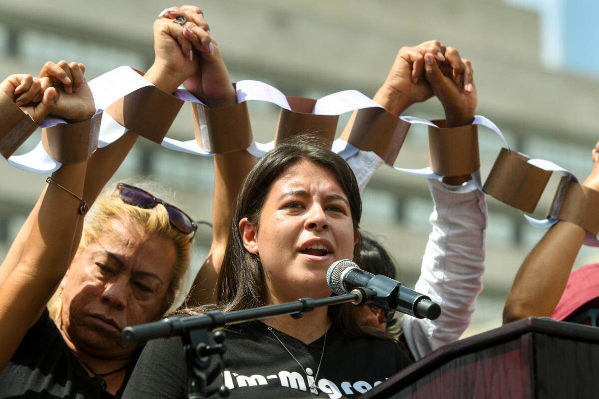 Melody Klingenfuss speaks during a Labor Day protest outside City Hall.