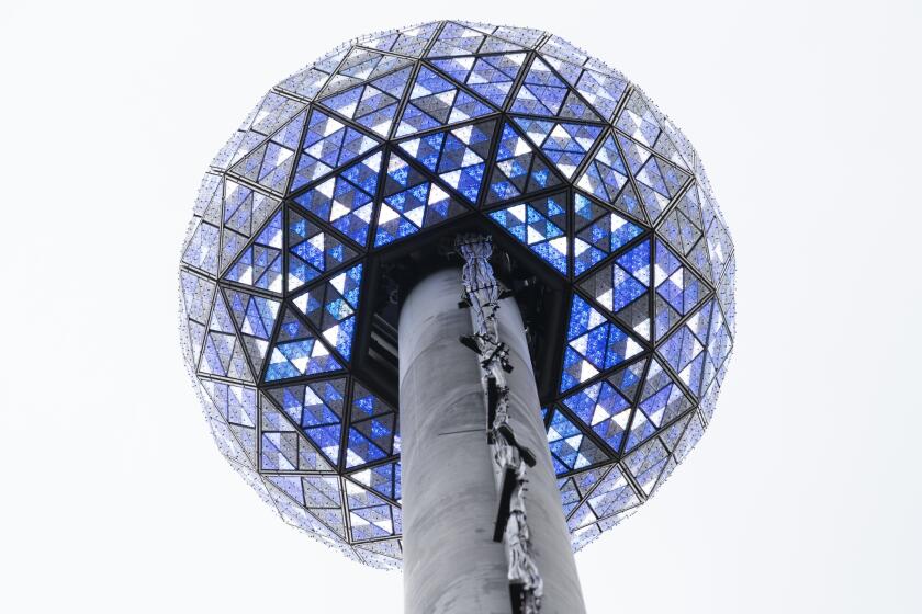 The New Year's Eve ball is prepared for its big moment in New York's Times Square. The 11,875-pound geodesic sphere, covered by 2,688 Waterford Crystal triangles, will descend a 130-foot pole to mark the stroke of midnight.