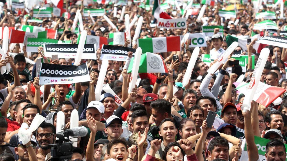 Fans of Mexico at zocalo square in Mexico City on Saturday celebrate their national team's second goal against South Korea in the World Cup.