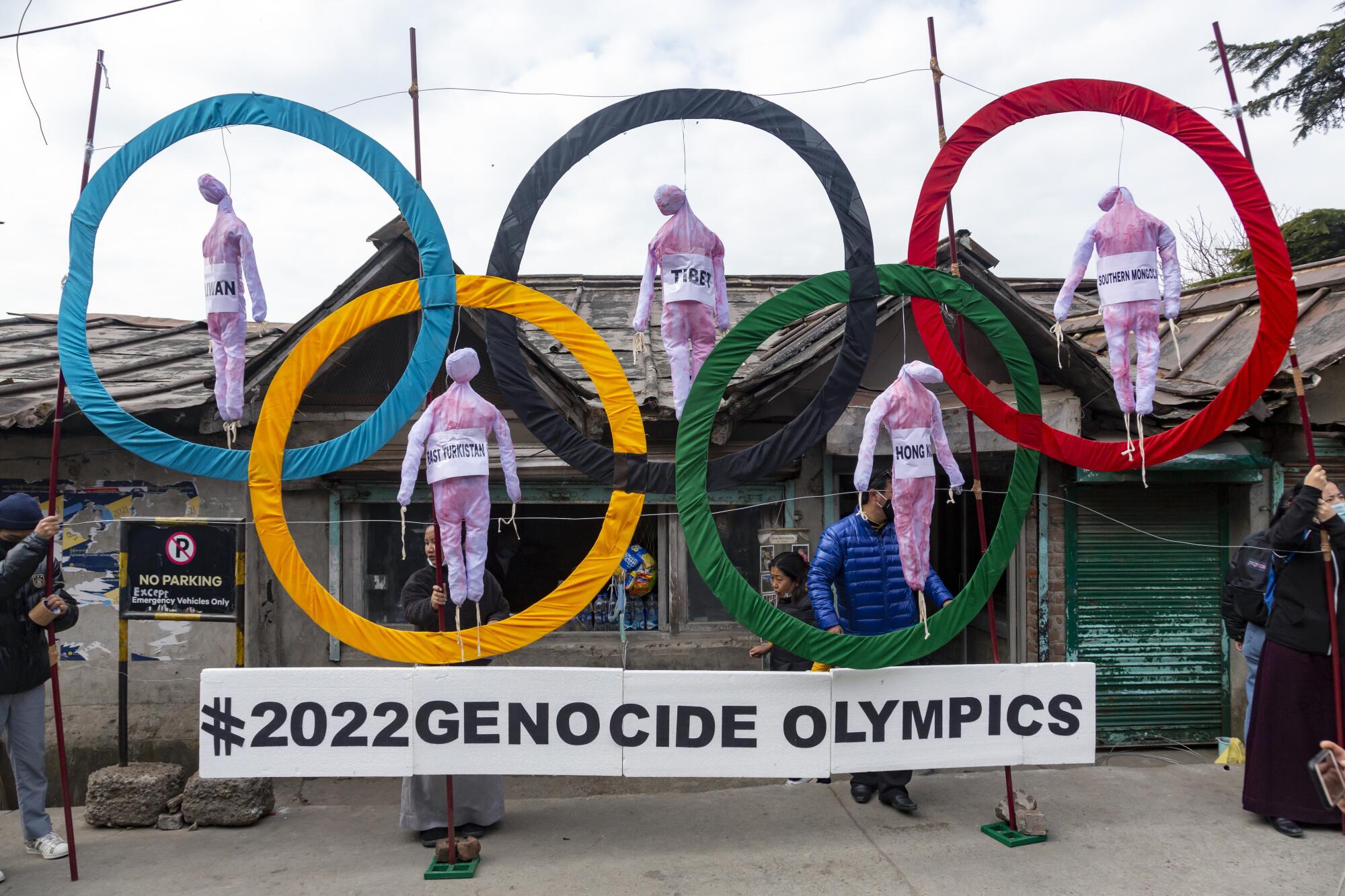 Exiled Tibetans use the Olympic Rings in Dharmsala, India, as a prop during a protest to China's alleged human-rights abuses.