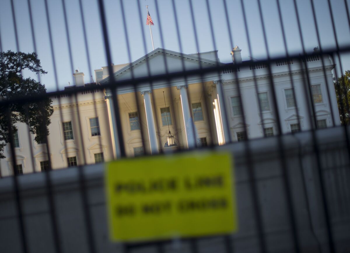 A perimeter fence sits in front of the White House fence along Pennsylvania Avenue in Washington. The Secret Service faces scrutiny anew in the wake of revelations about its fumbled response to shots fired at the White House in 2011.