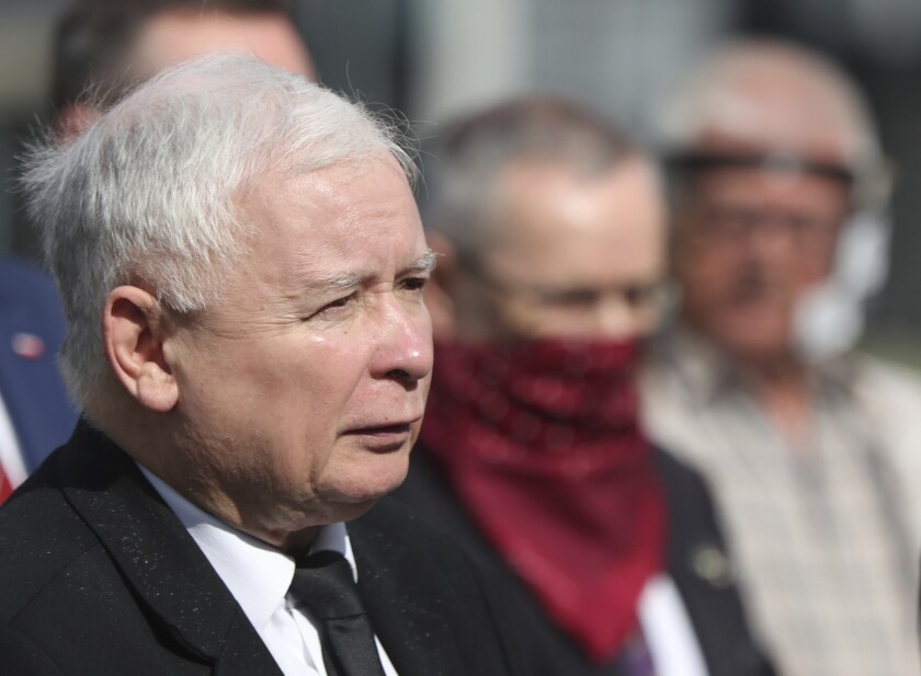 FILE - In this July 10, 2020 file photo, Poland's ruling party leader Jaroslaw Kaczynski, left, attends a police-guarded ceremony in Warsaw, Poland. An official with Poland's conservative governing party said Friday, Sept. 18, 2020, that the the country's right-wing coalition government has collapsed. (AP Photo/Czarek Sokolowski, file)