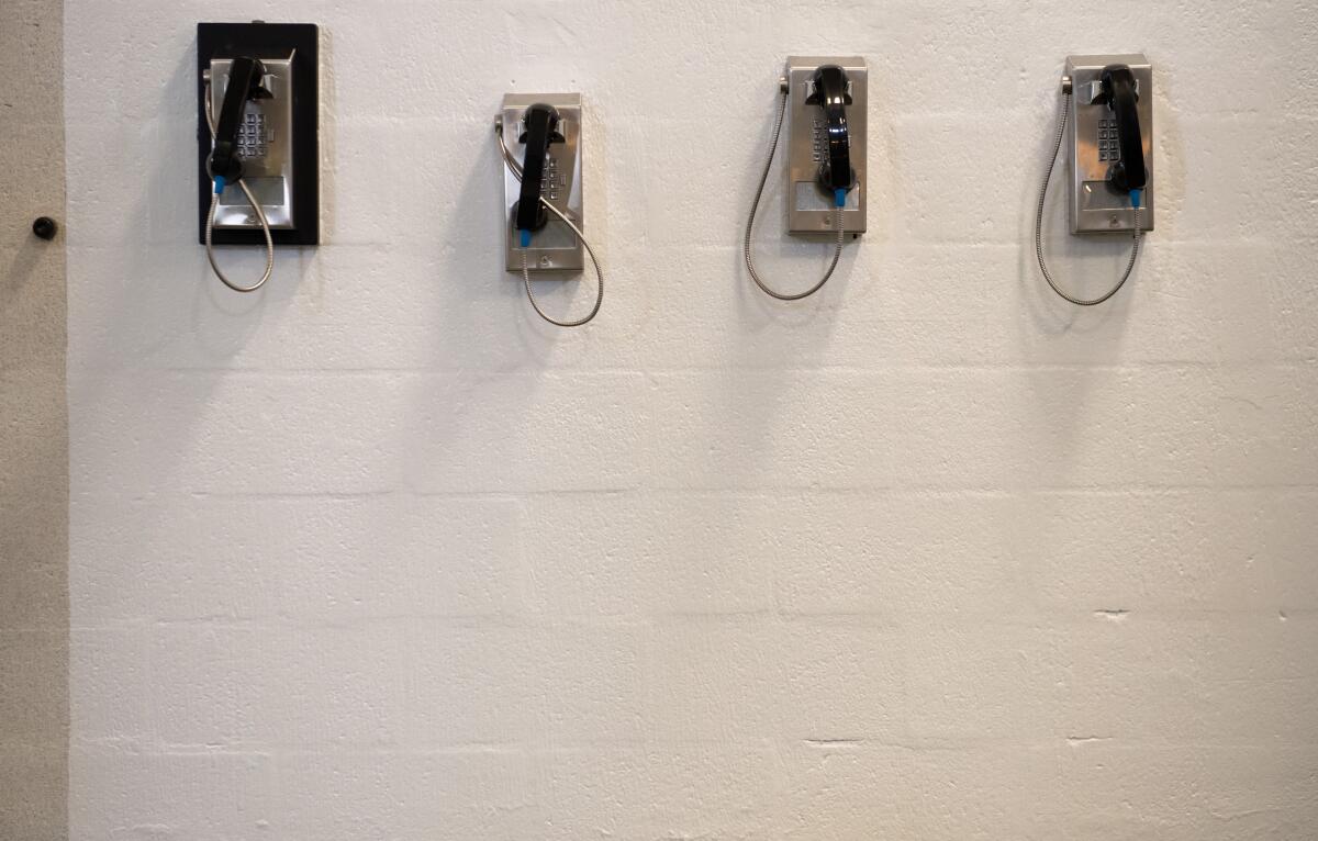 A bank of telephones for use by detainees.