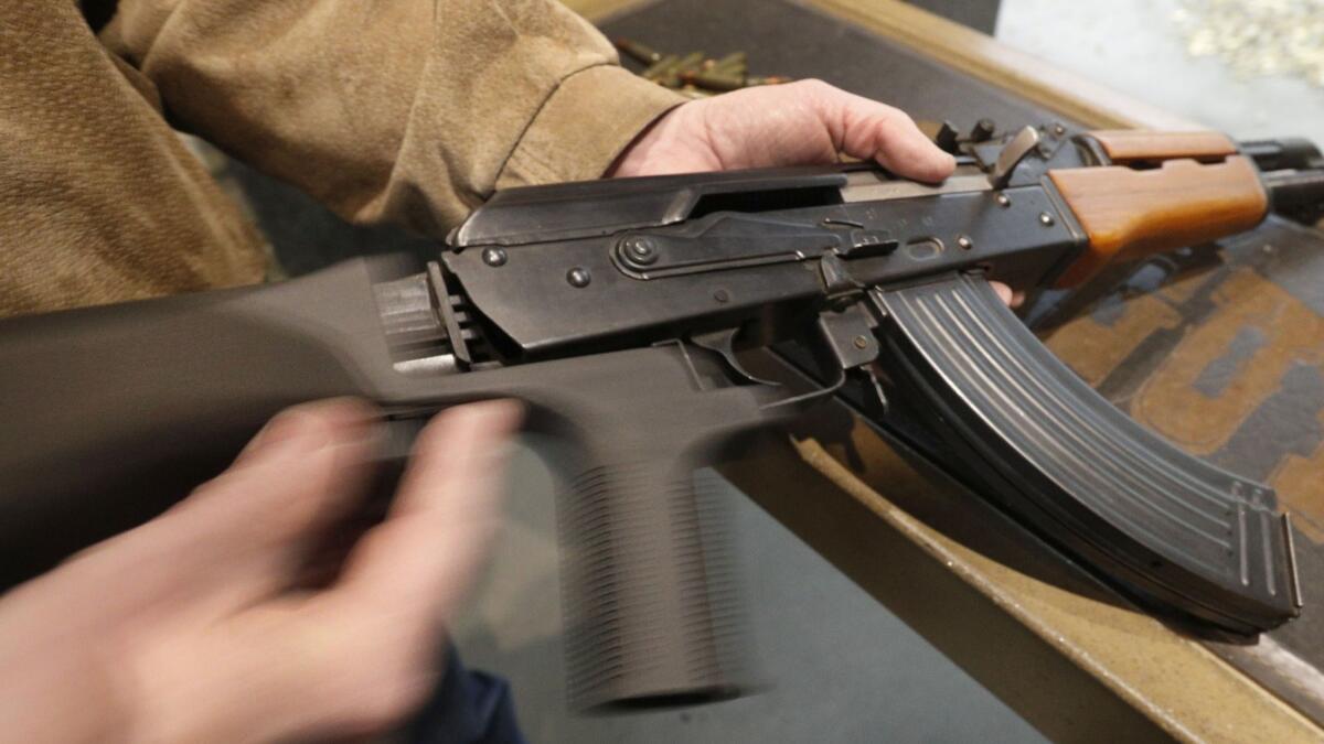 A bump stock is installed on an AK-47 at Good Guys Gun and Range on February 21, 2018 in Orem, Utah.