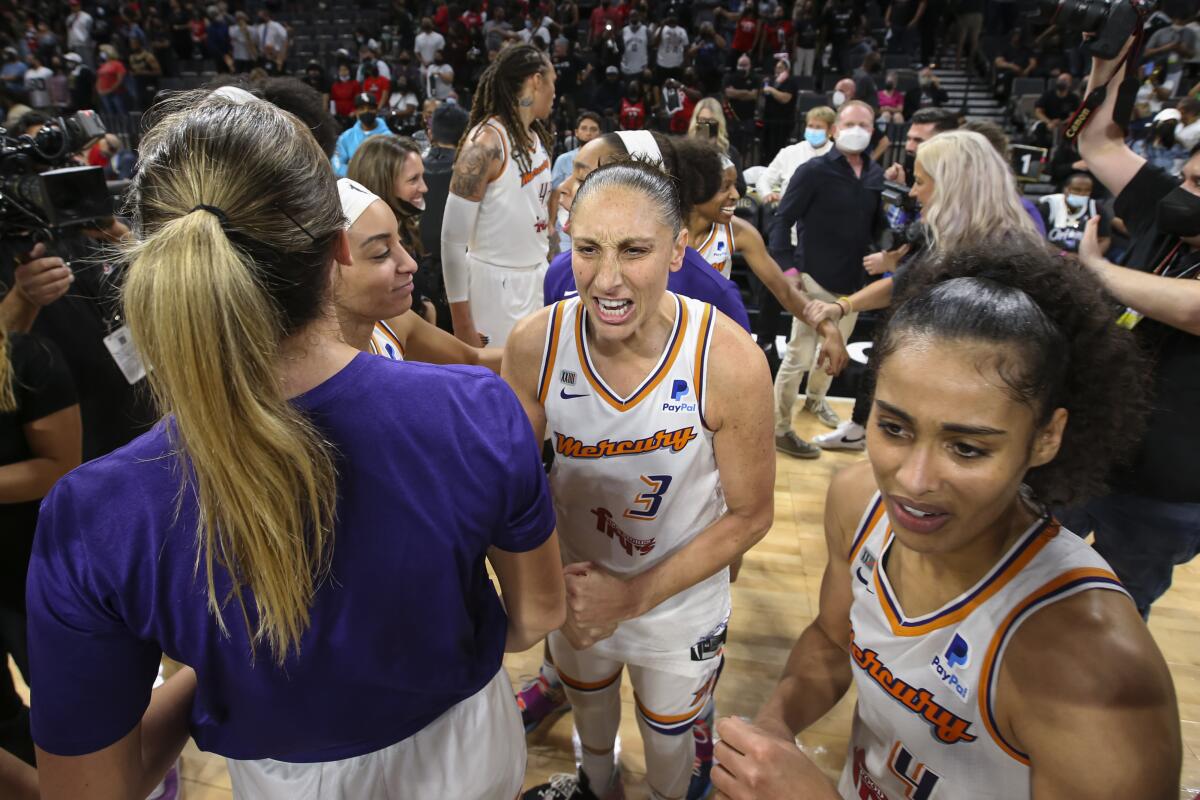 Mercury guard Diana Taurasi (3) celebrates with teammates after defeating the Aces.