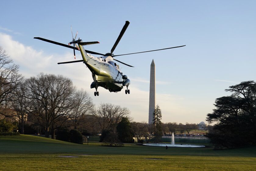 Marine One, with President Donald Trump and first lady Melania Trump aboard, lifts off the South Lawn of the White House, Wednesday, Dec. 23, 2020, in Washington, enroute to Andrews Air Force Base and then onto Florida. (AP Photo/Evan Vucci)