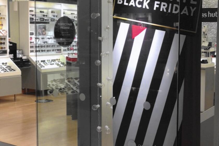 Signs for Black Friday deals are seen at the Fifth Avenue Mall in downtown Anchorage, one of only a few places in the state where rural Alaskans can go if they want to partake in the post-Thanksgiving consumer tradition.