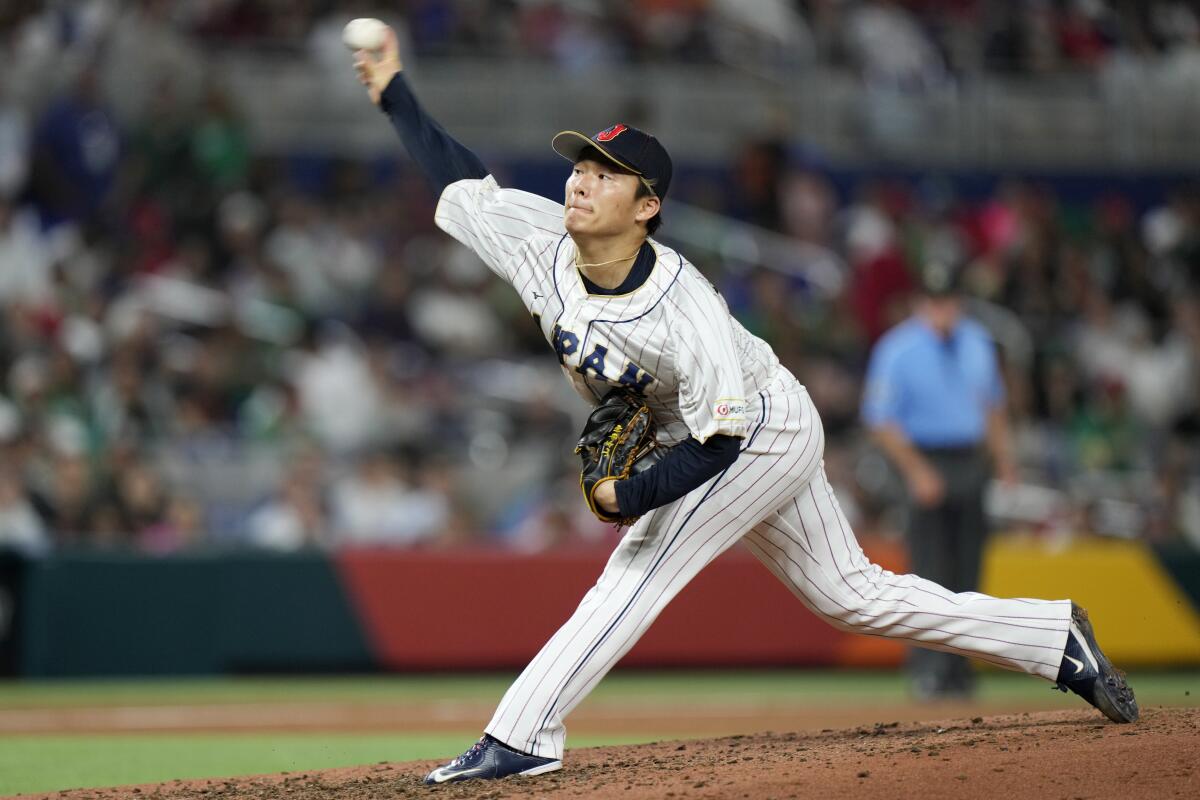 Japan's Yoshinobu Yamamoto delivers a pitch in a World Baseball game against Mexico on March 20, 2023, in Miami. 