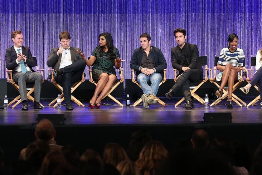 Buzzfeed's Jarett Wieselman, left, moderates PalyFest's panel with "The Mindy Project's" executive producer Matt Warburton, co-producer/actor Ike Barinholtz, executive producer/actress Mindy Kaling and costars Chris Messina, Ed Weeks, Xosha Roquemore, Zoe Jarman and Beth Grant on Tuesday at the Dolby Theatre in Hollywood.
