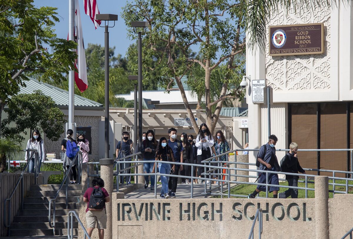 Students walking on campus at Irvine High School.