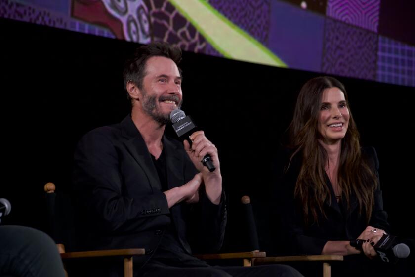 Keanu Reeves, left, and Sandra Bullock at a 30th anniversary screening of their 1994 hit, "Speed" on October 9, 2024.