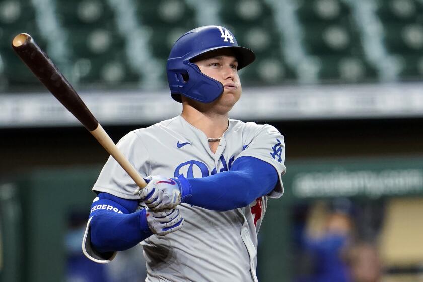 Los Angeles Dodgers' Joc Pederson bats against the Houston Astros during the second inning.