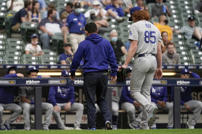 Dodgers pitcher Dustin May leaves the game after suffering an arm injury in the second inning at Milwaukee on May 1, 2021.