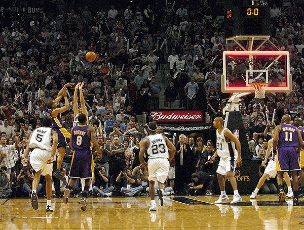 In a Western Conference semifinal game in 2004, Fisher made one of the biggest ones. And it all played out in 0.4 seconds. That's how much time was left on the clock when San Antonio's Tim Duncan made a shot to give the Spurs a one-point lead. Fisher followed with a winner. He took an inbound pass from Gary Payton and in the same motion turned and fired an 18-foot shot over Manu Ginobili before the horn sounded. "As it got closer," Fisher said, "I knew the ball was going in." The shot, which Times columnist Bill Plaschke deemed the second-biggest shot in franchise history, established Fisher as one of the most clutch performers to wear a Lakers uniform, a reputation he has lived up to many times.