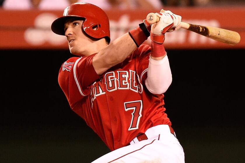 Angels outfielder Collin Cowgill hits a walk-off home run against the Oakland Athletics on June 10. Cowgill was activated from the disabled list Monday.