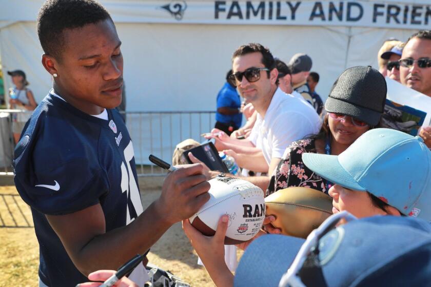 IRVINE, CALIF. -- MONDAY, AUGUST 13, 2018: Rams wide receiver Pharoh Cooper signs autographs for fans during the Los Angeles Rams training camp at UC-Irvine in Irvine, Calif., on Aug. 13, 2018. (Allen J. Schaben / Los Angeles Times)