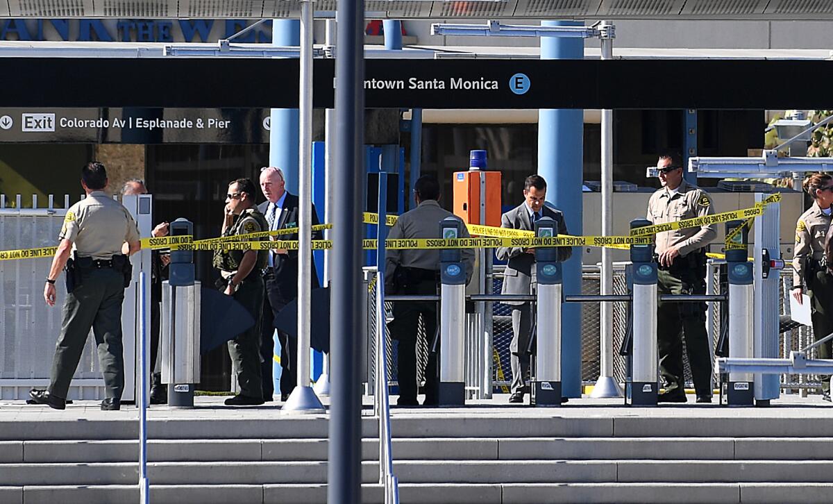 Authorities investigate the Expo Line station in Santa Monica, where on Oct. 4 Thomas Napack allegedly charged toward two deputies, one of whom shot Napack.