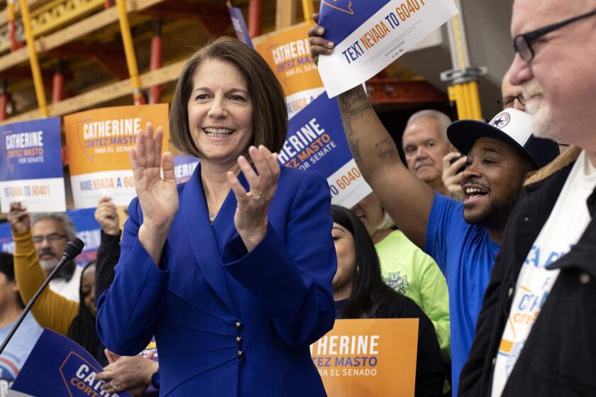 Sen. Catherine Cortez Masto, D-Nev., surrounded by supporters from local unions, speaks during a news conference celebrating her U.S. Senate race win, Sunday, Nov. 13, 2022, in Las Vegas. Cortez Masto beat Republican candidate Adam Laxalt, securing a Democratic majority in the U.S. Senate. (AP Photo/Ellen Schmidt)