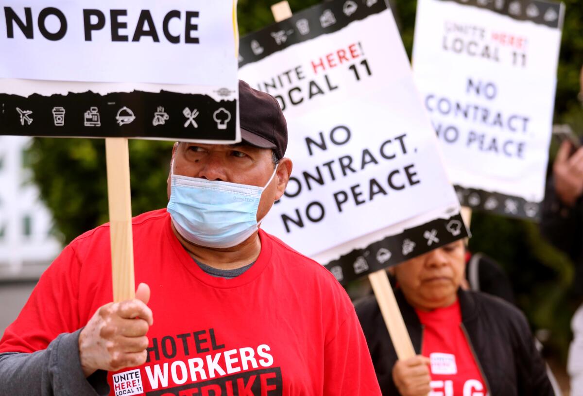 Jose Ayala holding a sign