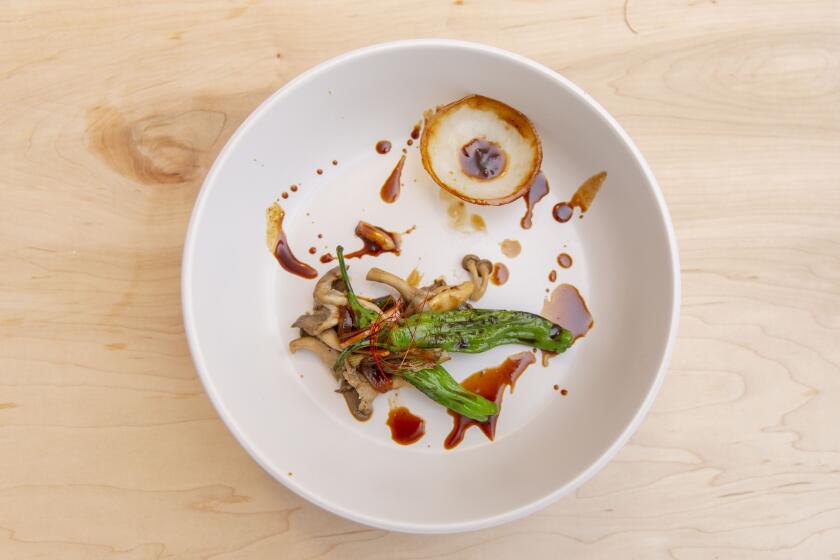LOS ANGELES, OCTOBER 27, 2019: Fire mushroom is on the Fall 2019 menu of Michelle LeeÕs tasting dinners and includes oyster mushroom, charred shishito peppers and onions.Ê(Allison Zaucha / For The Times)