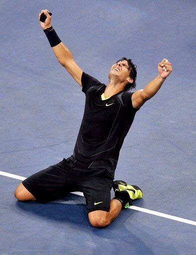 Rafael Nadal begins to celebrate after defeating Novak Djokovic in the U.S. Open men's final on Monday at Arthur Ashe Stadium in New York.