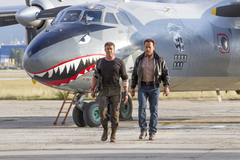 Sylvester Stallone and Arnold Schwarzenegger in a scene from "The Expendables 3."