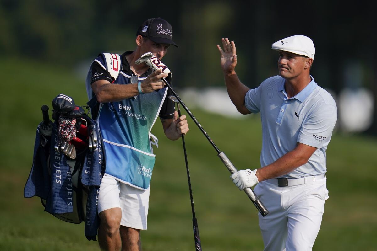Bryson DeChambeau reacts after chipping on the 16th hole during the third round of the BMW Championship on Aug. 28, 2021.